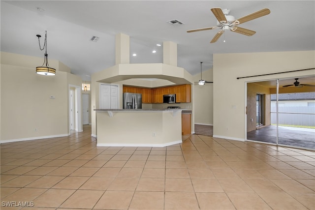 kitchen featuring stainless steel appliances, hanging light fixtures, light tile patterned floors, a kitchen breakfast bar, and high vaulted ceiling