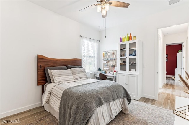 bedroom featuring ceiling fan and light hardwood / wood-style floors