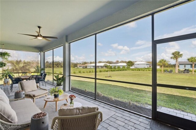 sunroom / solarium with ceiling fan