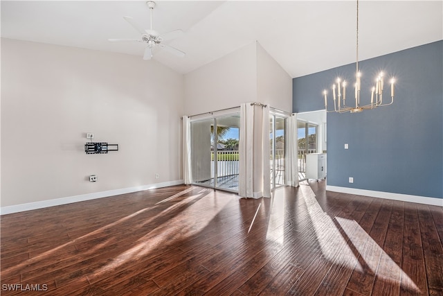 unfurnished room with dark hardwood / wood-style floors, ceiling fan with notable chandelier, and lofted ceiling