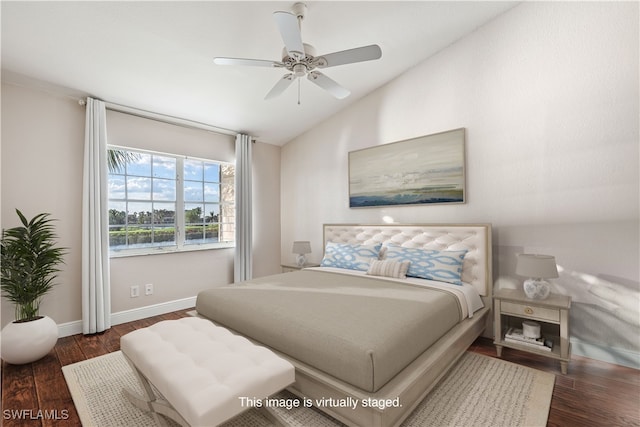 bedroom featuring ceiling fan, vaulted ceiling, and dark hardwood / wood-style floors