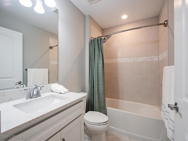 full bathroom featuring toilet, shower / tub combo with curtain, and vanity