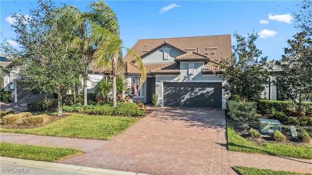 view of front of house featuring a front yard and a garage