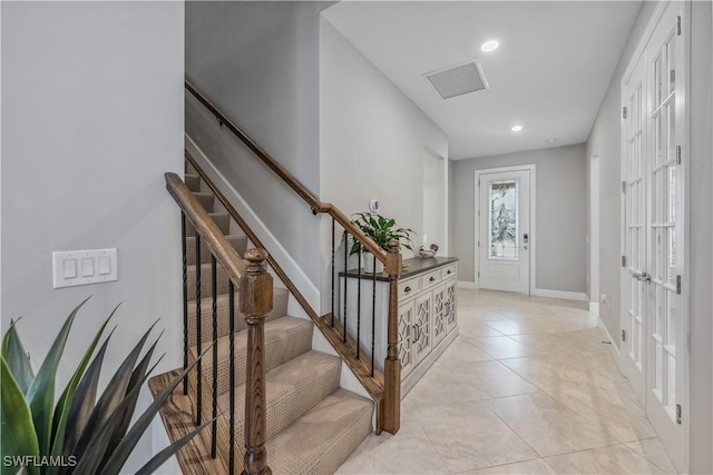 tiled foyer with french doors