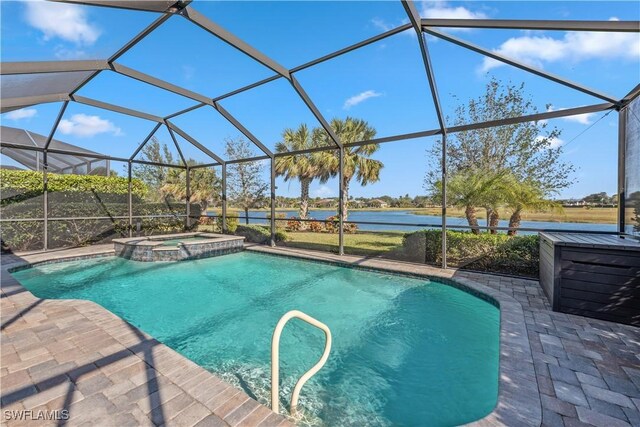 view of swimming pool with a lanai, a water view, an in ground hot tub, and a patio area