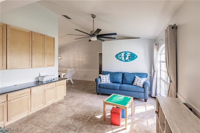 living room featuring ceiling fan and lofted ceiling