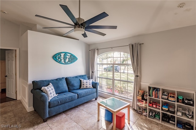 living room featuring ceiling fan and light tile patterned flooring