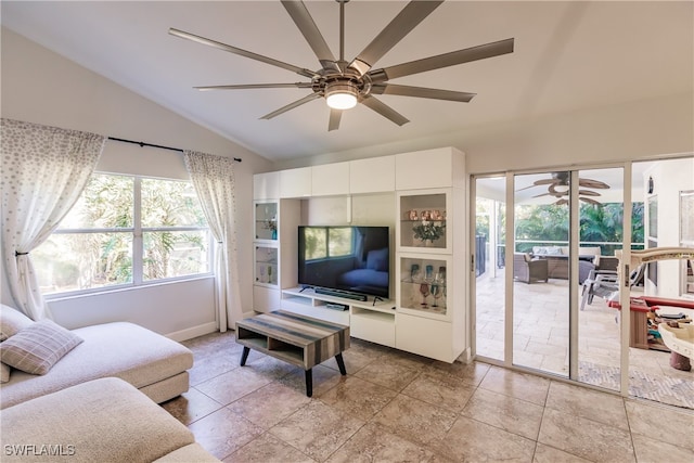 living room with ceiling fan and vaulted ceiling