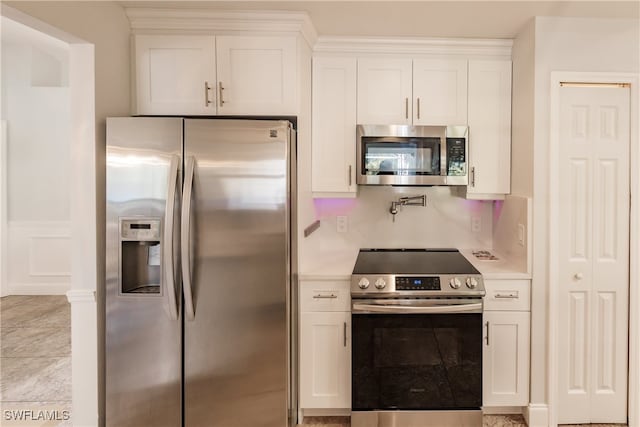 kitchen featuring white cabinets and stainless steel appliances