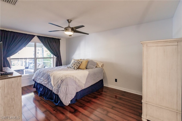 bedroom with ceiling fan and dark wood-type flooring