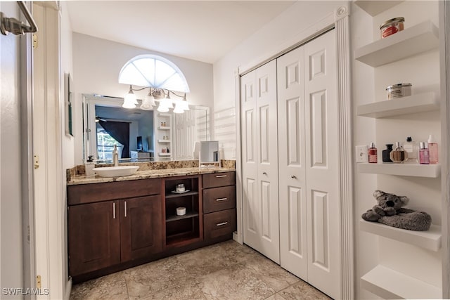 bathroom with plenty of natural light and vanity