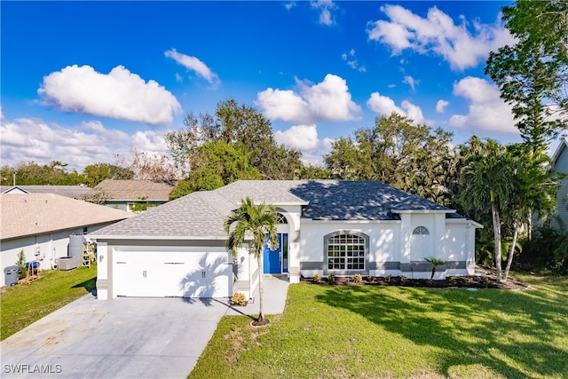 single story home featuring a garage and a front yard