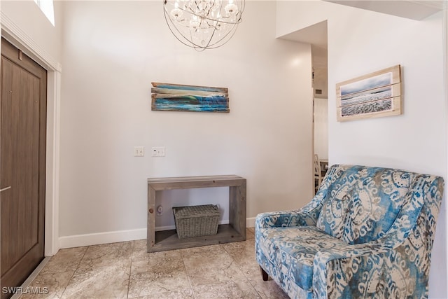 living area with an inviting chandelier