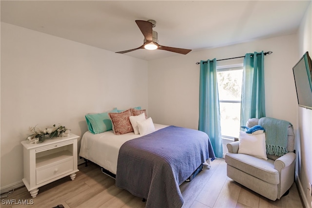 bedroom with light wood-type flooring and ceiling fan