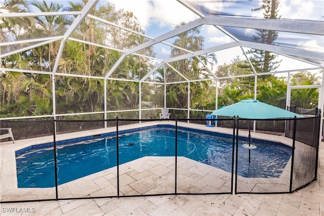 view of pool featuring a lanai and a patio