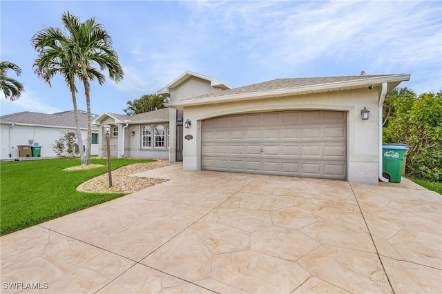 ranch-style home with a garage and a front lawn