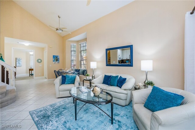 living room featuring high vaulted ceiling, light tile patterned flooring, and ceiling fan