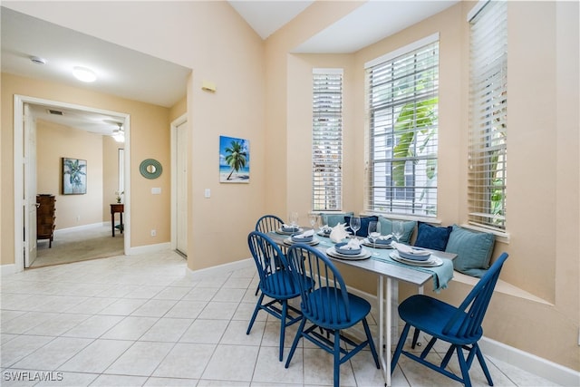 dining room featuring light tile patterned flooring and baseboards