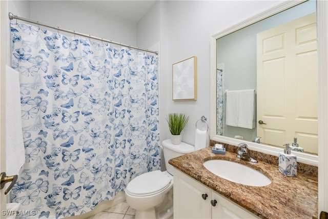 bathroom featuring vanity, toilet, and tile patterned floors