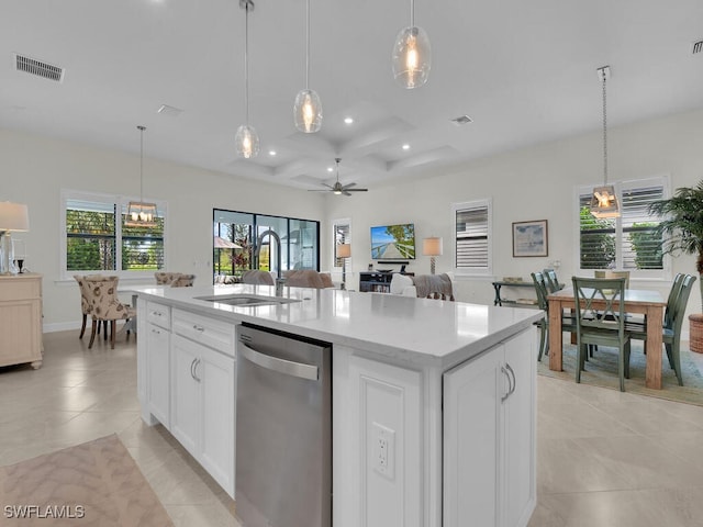 kitchen with white cabinets, ceiling fan, a kitchen island with sink, sink, and dishwasher