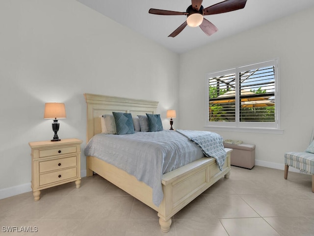 bedroom with ceiling fan and light tile patterned flooring