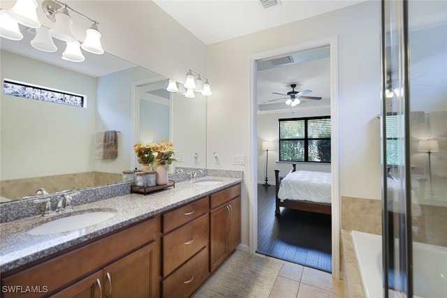 bathroom with vanity, wood-type flooring, a shower with door, and ceiling fan