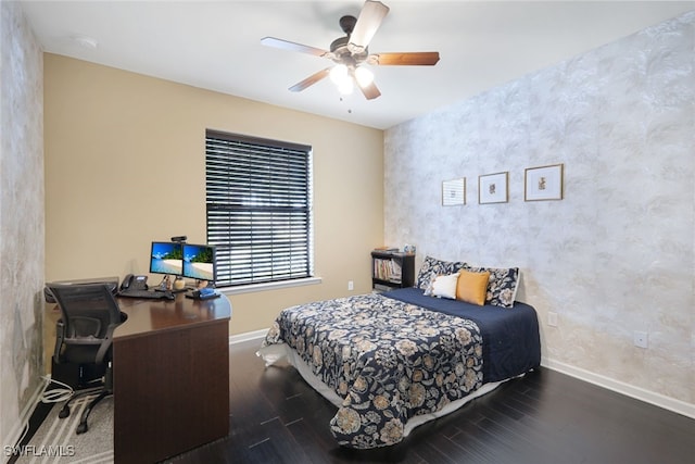 bedroom featuring dark hardwood / wood-style flooring and ceiling fan