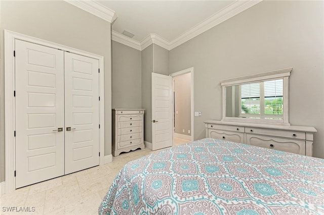 bedroom featuring a closet and crown molding