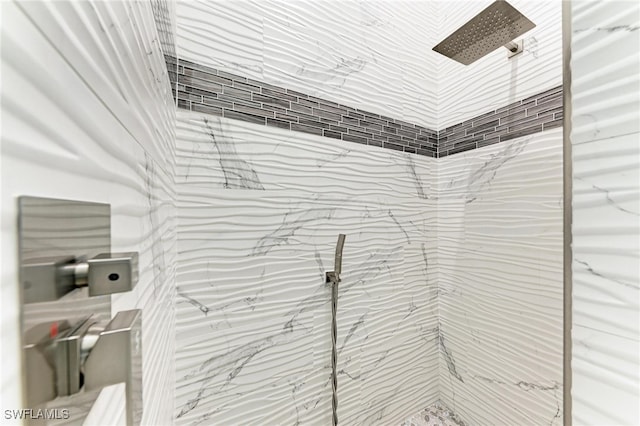 interior space featuring tiled shower