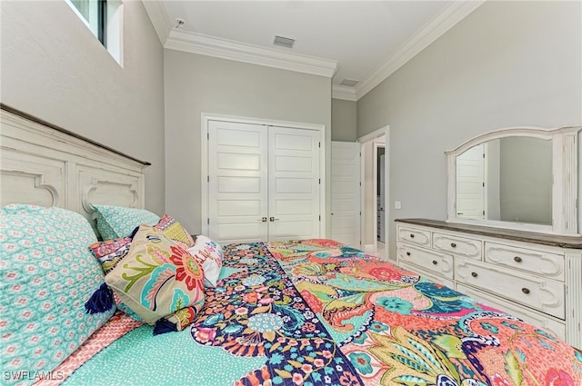 bedroom with a closet and ornamental molding