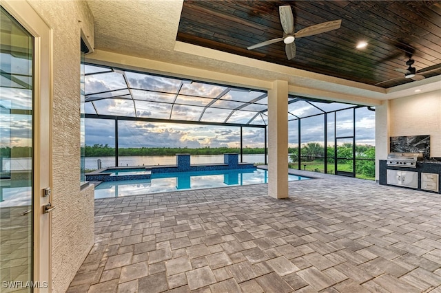 view of pool with ceiling fan and a water view