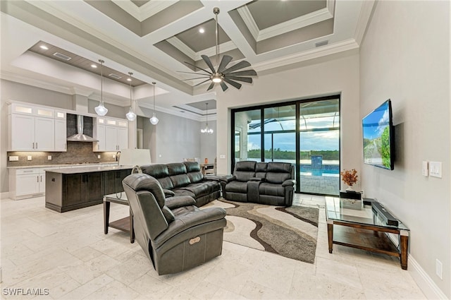 living room with ceiling fan, beam ceiling, crown molding, and coffered ceiling