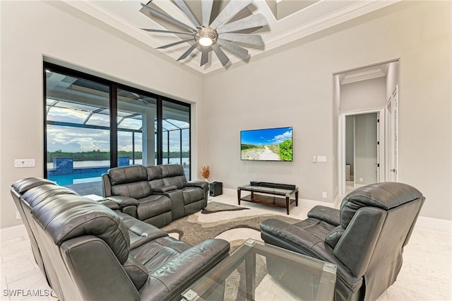 living room with ceiling fan and crown molding