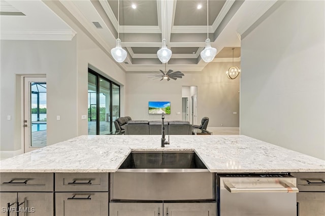 kitchen featuring sink, light stone counters, and crown molding