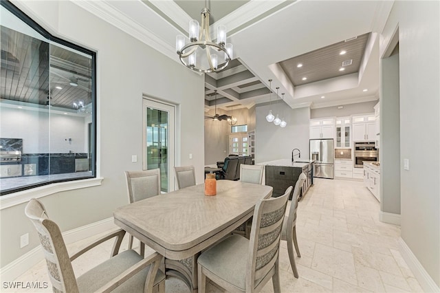 dining area featuring crown molding, beam ceiling, coffered ceiling, sink, and a chandelier