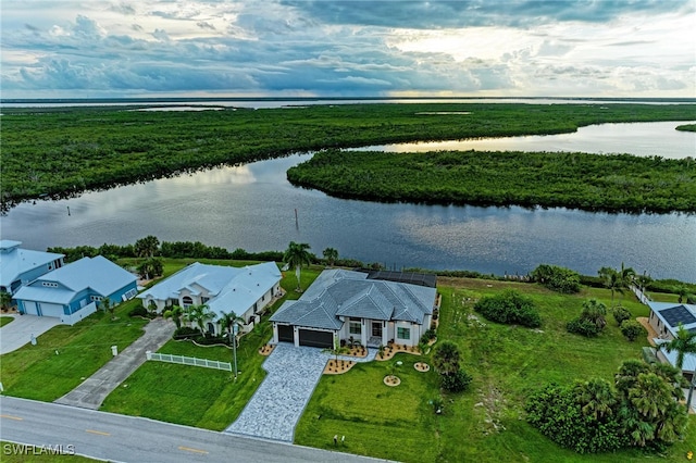 birds eye view of property featuring a water view