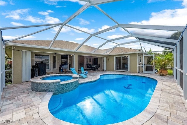 view of pool with an in ground hot tub, a patio, and a lanai