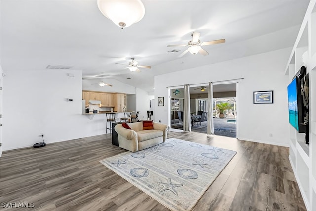 living room featuring ceiling fan, dark wood-type flooring, and vaulted ceiling