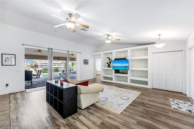 living room featuring hardwood / wood-style flooring, ceiling fan, and lofted ceiling