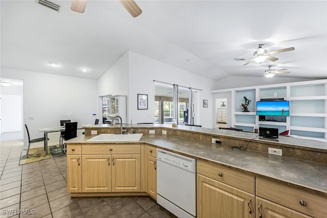 kitchen with dishwasher, tile patterned flooring, lofted ceiling, and sink