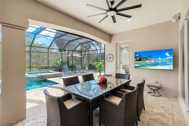 view of patio with ceiling fan, glass enclosure, and a swimming pool with hot tub