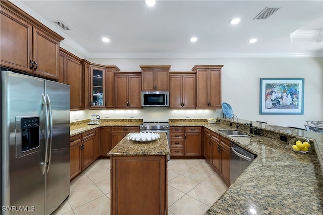 kitchen featuring stainless steel appliances, light tile patterned floors, sink, ornamental molding, and stone countertops