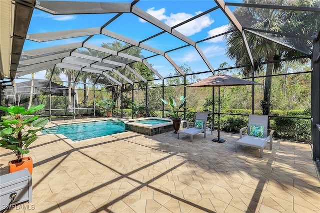 view of swimming pool featuring a patio, a lanai, and an in ground hot tub