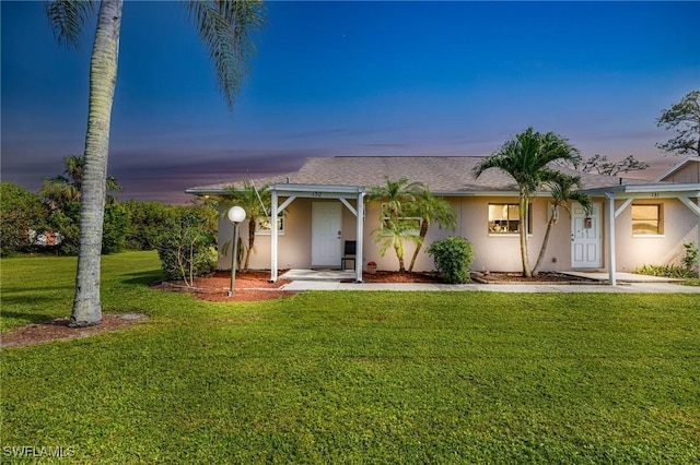 view of front of home featuring a lawn