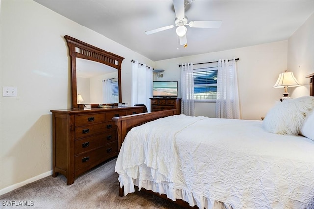 bedroom with ceiling fan and light carpet