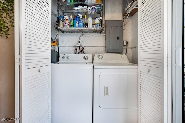 washroom with electric panel and independent washer and dryer