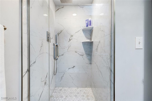 bathroom with a tile shower