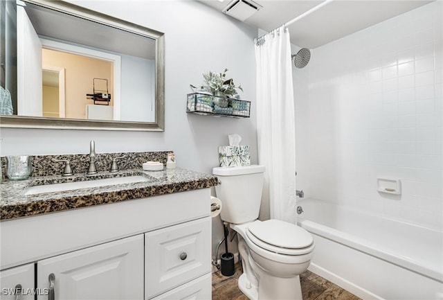 full bathroom with wood-type flooring, toilet, vanity, and shower / bath combination with curtain