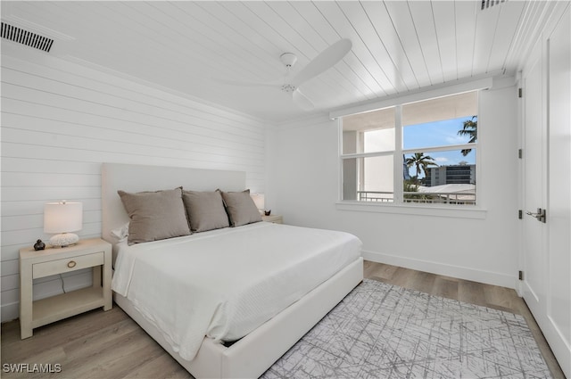 bedroom with wooden ceiling, ceiling fan, and light wood-type flooring