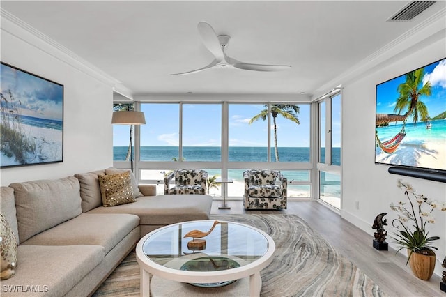 living room with expansive windows, ceiling fan, ornamental molding, and wood-type flooring